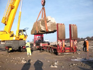 Granite block being lifted onto low loader